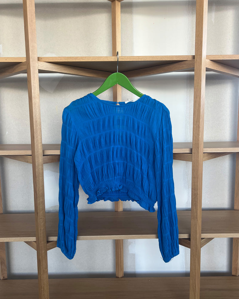 MIRELLA LONG SLEEVE CROP TOP TBF01630 | This piece is second hand and therefore may have visible signs of wear. But rest assured, our team has carefully reviewed this piece to ensure it is fully functional &...