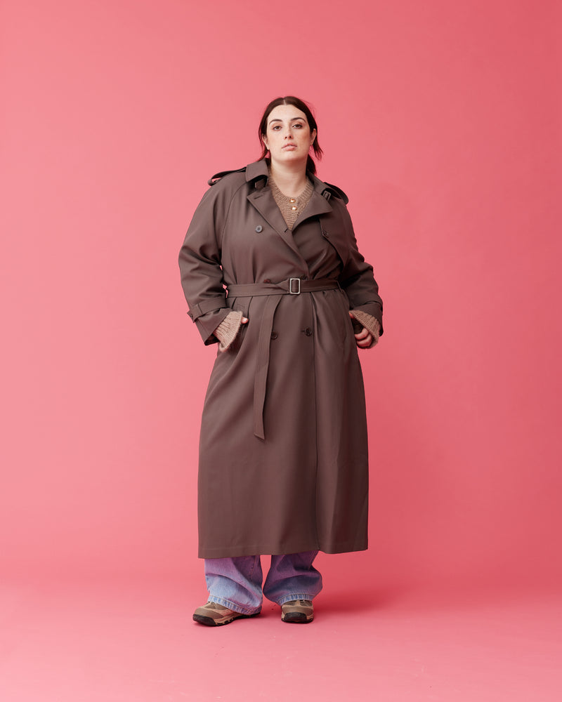 ANNIE TRENCH COAT DONKEY | Oversized midi-length trench with a self-fabric belt, button fastenings and, epaulettes at the shoulders and the sleeve. A classic shape imagined in mid-weight donkey coloured fabric.