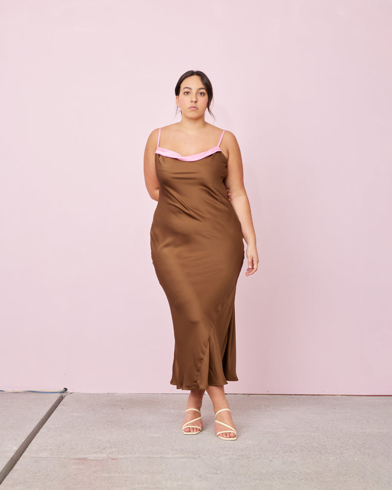 GEMINI SATIN SLIP BRONZE CANDY | Bias cut slinky slip dress crafted in a luxe satin. With a two-toned colour detail at the neckline and adjustable straps, this dress is chic and unique.