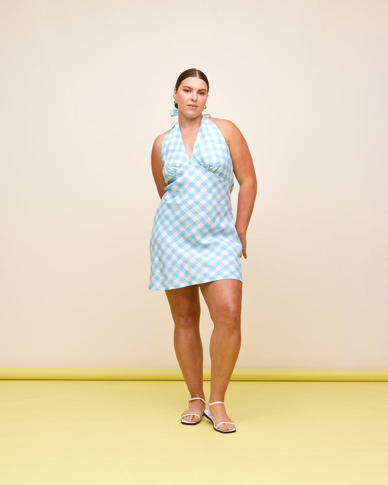 MORGAN LINEN MINI DRESS BLUE LINEN GINGHAM | Halter linen mini dress designed in blue and white gingham. Have fun with the styling of this piece by wearing it as a tunic-style top as well as a dress!