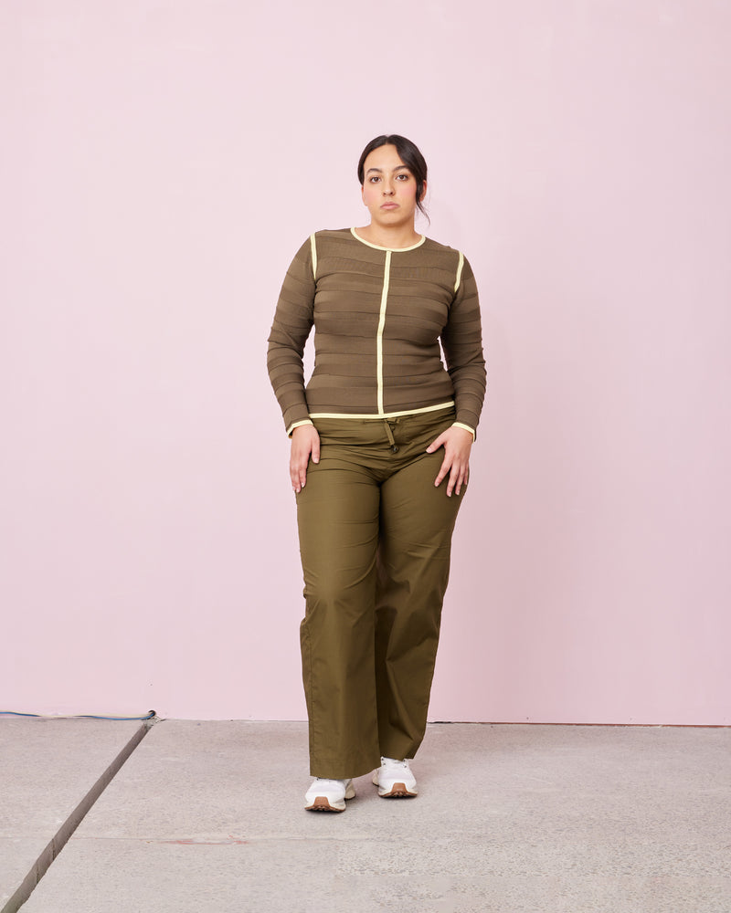 GEMINI LONG SLEEVE KHAKI LEMON STRIPE | Long sleeve top with two-toned design and contrast edges make a bold statement, while its knit blocking detail gives it a sophisticated look. Its stylish comfort ensures you look great...