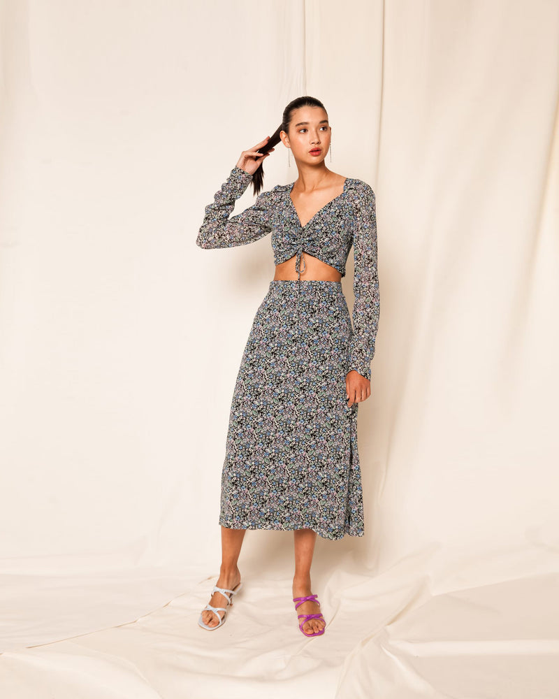 HIGH WAIST FLORAL MIDI SKIRT TBF02104 | This piece is second hand and therefore may have visible signs of wear. But rest assured, our team has carefully reviewed this piece to ensure it is fully functional &...