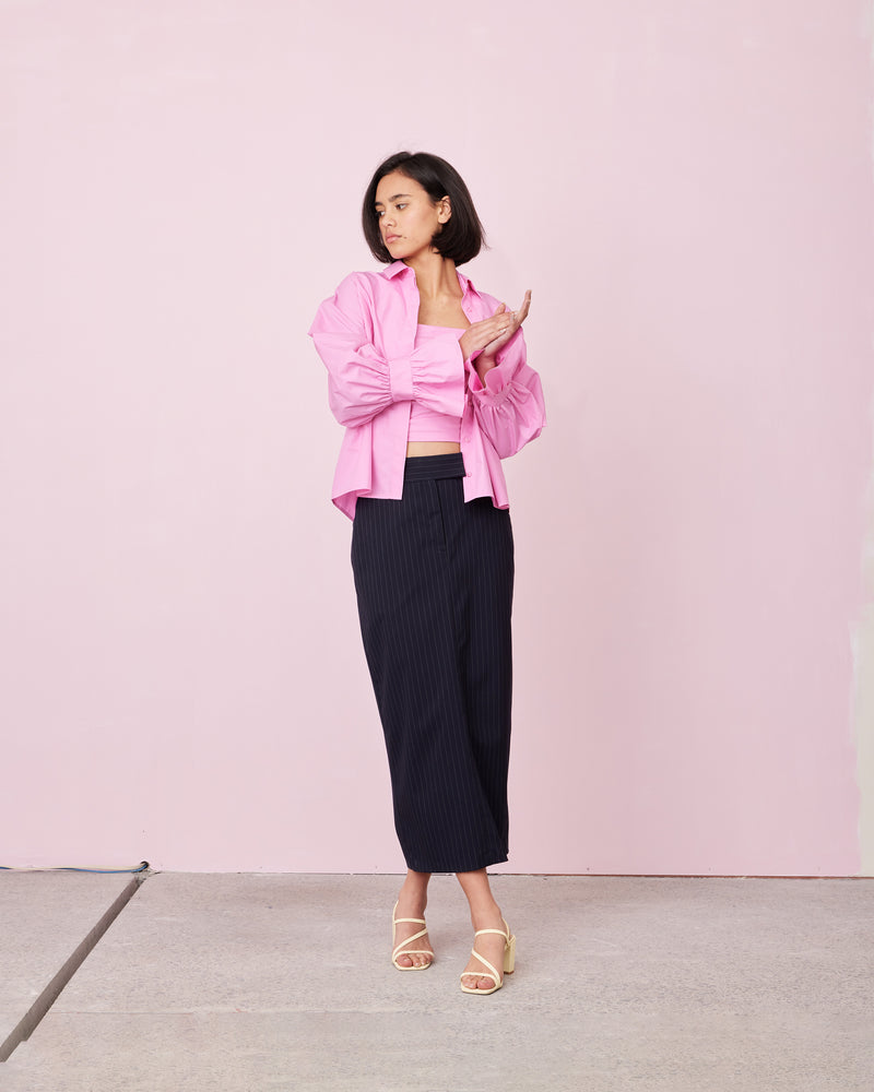 COMET SHIRT ORCHID | Boxy shaped shirt that sits longer through the back with fluted cuff detailing cut in a crisp pink orchid cotton. Designed to be a stand out, the fabric of this...