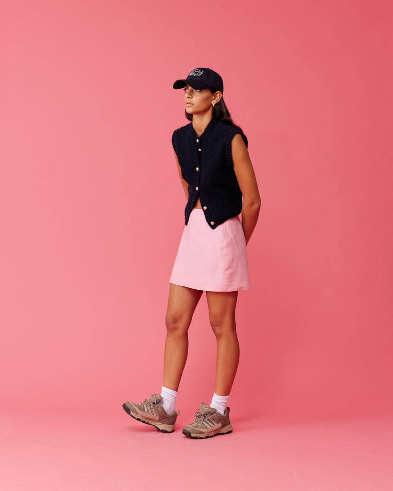 MORGAN LINEN MINI SKIRT  PINK | A-line shape mini skirt designed in a crisp pink mid-weight linen. This skirt is the perfect wardrobe staple with a tee or sweater.
