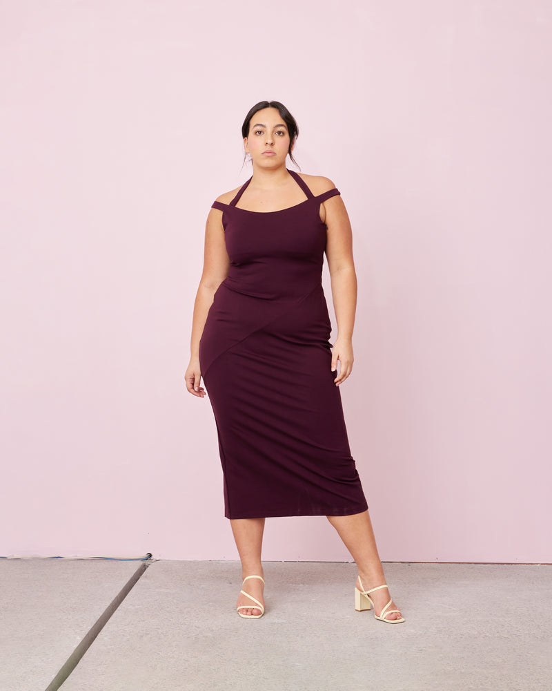 CALVIN DRESS PLUM | 
Sleeveless stretch midi dress with feature halter strap and off shoulder straps. Designed for a close fit, this dress is an elevated wardrobe staple.