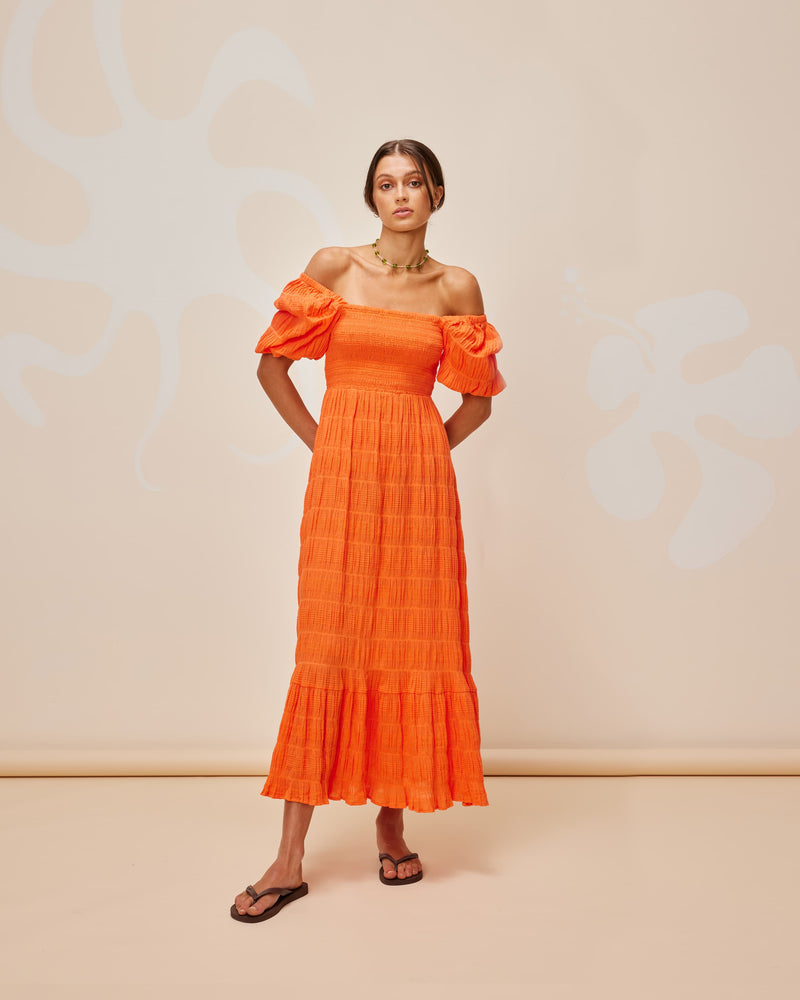 MIRELLA BABYDOLL DRESS APEROL | Short sleeve midi dress designed in the signature Mirella fabric, a delicate embroidered cotton. Features a babydoll-style bodice that falls to a floaty A-line skirt. Wear this dress on or...