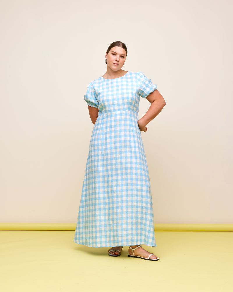 VIDA LINEN DRESS BLUE LINEN GINGHAM | Puff sleeve linen midi dress designed in a blue and white gingham. Turns to reveal a cut-out back that ties at the back neck, and a soft a-line skirt.