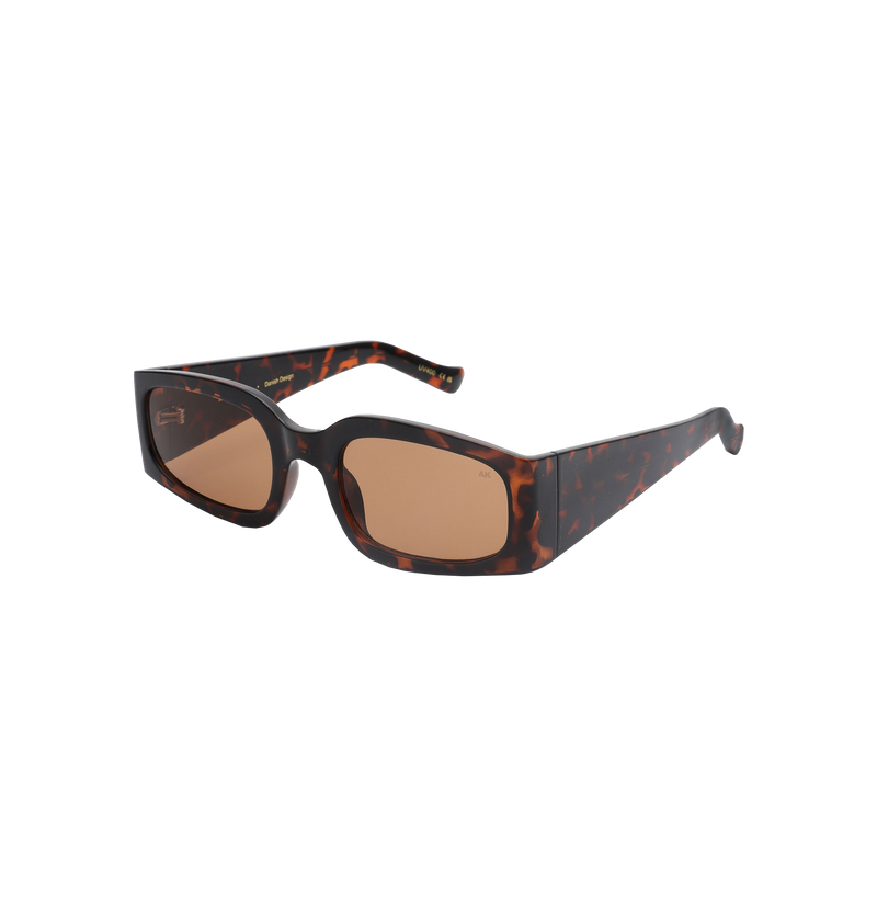 ALEX SUNGLASS DEMI TORTOISE | Narrow but oversized, the Alex sunglass is a modern, statement shape.