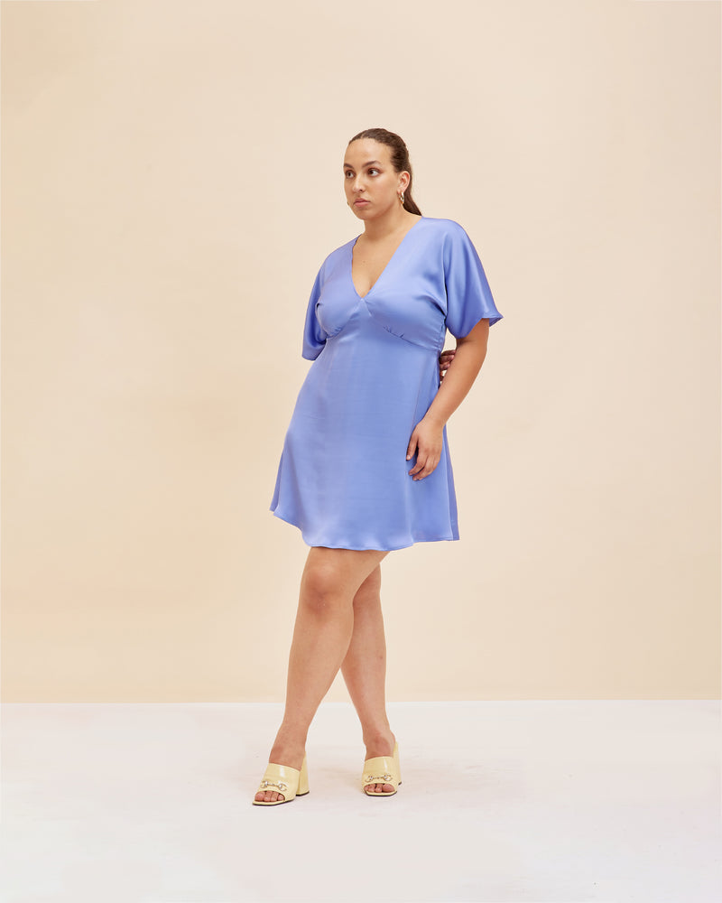 BETTINA SATIN MINI DRESS PERIWINKLE | V-neck mini dress with short flute sleeves in a lush periwinkle satin. Seam detail under the bust and a waist tie means this dress fits to perfection.