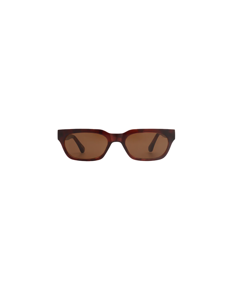 BROR SUNGLASS DEMI LIGHT BROWN | Rectangle-shaped framed paired with a narrow lens give this sunglass a bold look without sitting to large. Features a dark brown frame and lens.