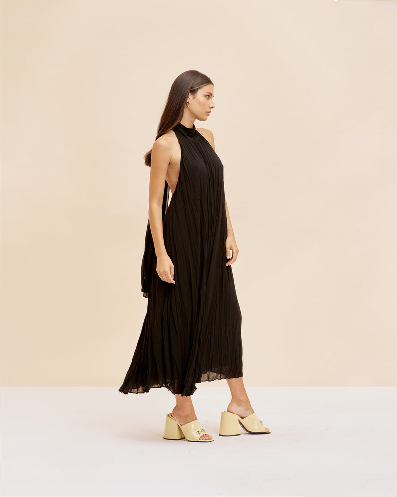 CASCADE CRUSH GOWN BLACK | A RUBY favourite, this gown features crushed pleats and a halter neckline with dramatic back neck ties in black. The soft a-line shape and crushed pleating create beautiful movement as...