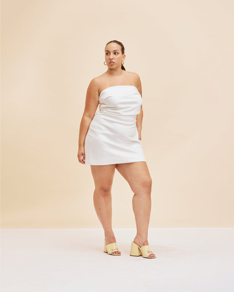 CHER SATIN MINIDRESS PEARL | This minidress has a fitted bodice, with tucks crossing the bust, falling to mid-thigh. Cut in a sheeny pearl satin, enter the Cher Minidress.