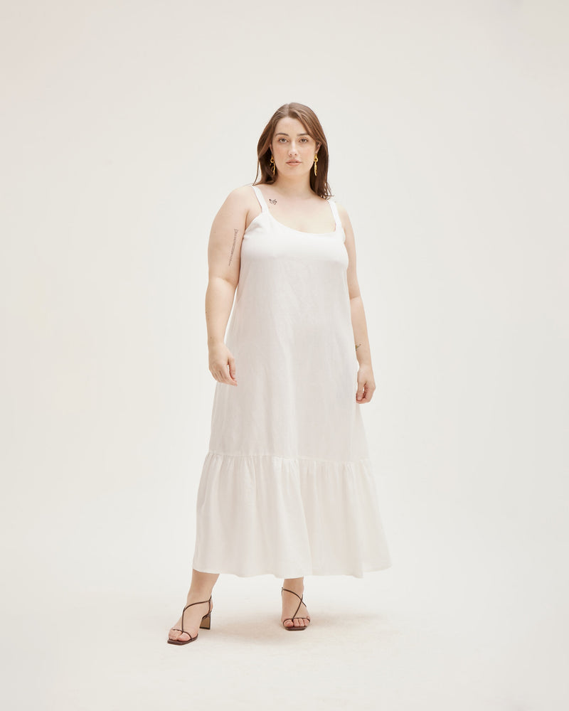 CITRUS MAXI DRESS WHITE | Relaxed loose fitting linen maxi dress featuring a low back, ruffle hem detail and wide straps. Designed to be floaty, this dress is the perfect staple dress.
