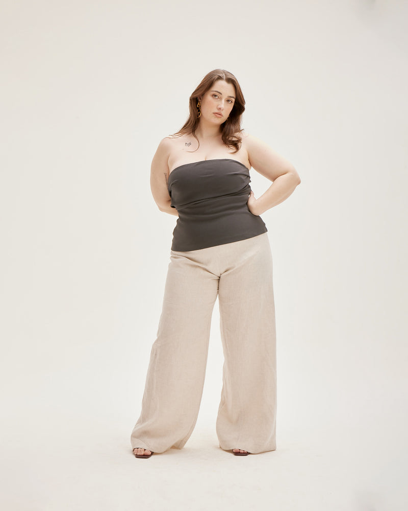MARLEY LINEN PANT NATURAL | Highwaisted, wide leg linen pants that sit above the belly button, these are sure to be on high rotation in your trans-seasonal wardrobe. Sitting flat at the waistband, they flare...