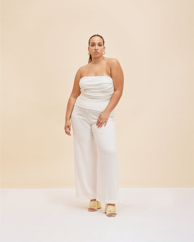 FIREBIRD PANT PETITE CREAM | Classic highwaisted pant with a straight leg silhouette, in a petite length. An effortless and versatile piece perfect for work and beyond. This colourway is lined for coverage.