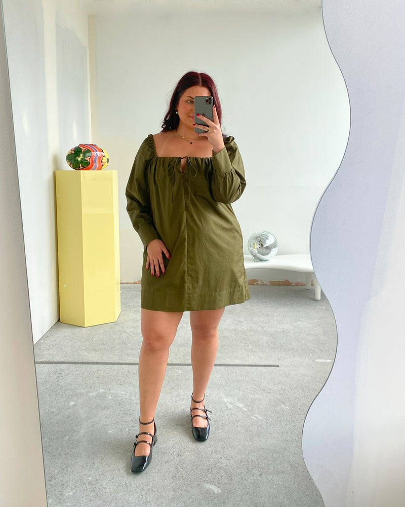 RSR SAMPLE 3518 HERO MINIDRESS | RUBY Sample Hero Minidress in olive. Size 16. One available. Isla is 170cm tall and usually wears a size 16. She measures: BUST: 113cm, WAIST: 100cm, HIP: 129cm
