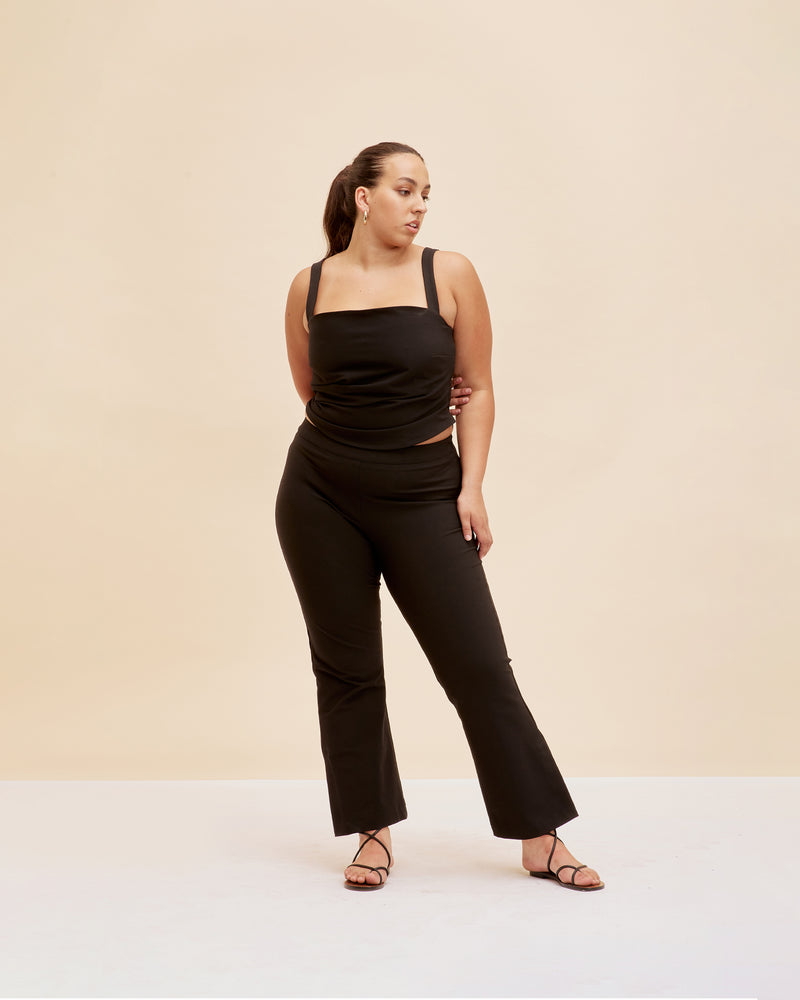 JUPITER BODICE BLACK | Fitted cropped sleeveless bodice designed in a stretch bengaline fabric. This top features tuck detailing throughout which cinches the waist.