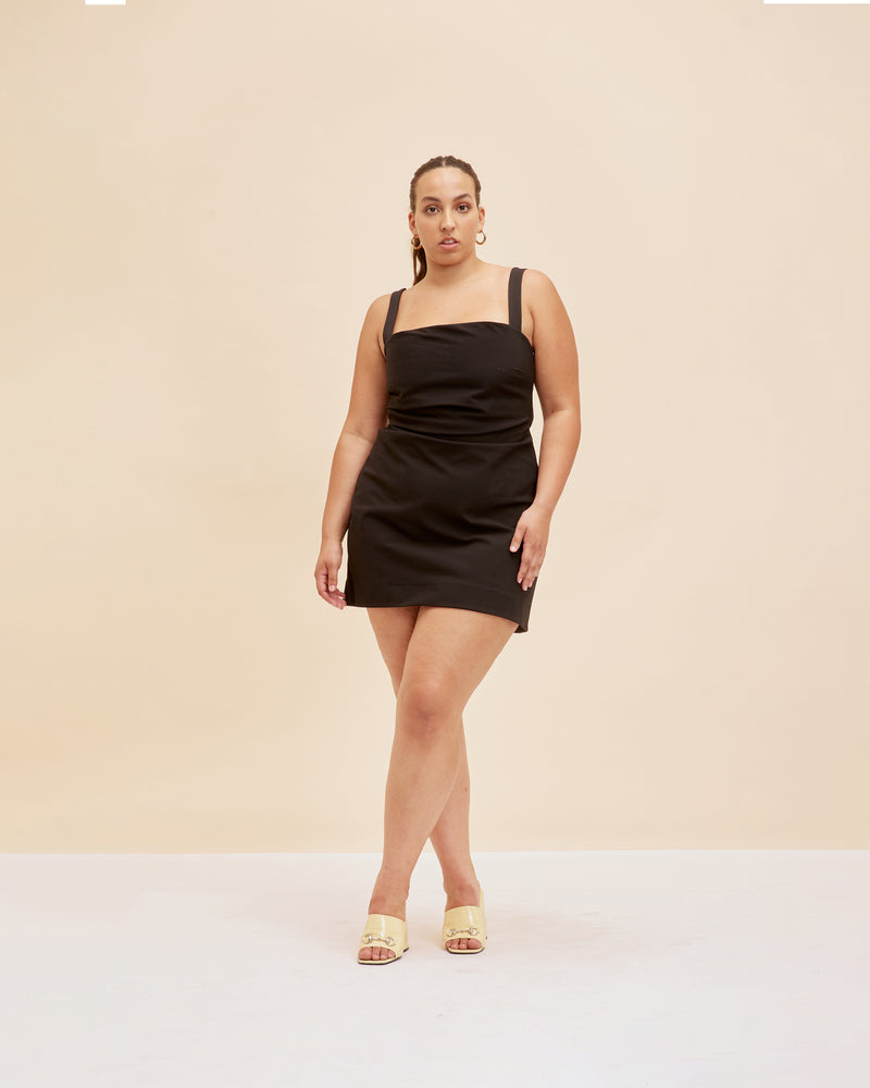 JUPITER MINI DRESS BLACK | Wide-strap mini dress with a square neckline designed in a stretch bengaline fabric. Features a fitted bodice with deep waist tucks to create shape, this is truly the perfect little...