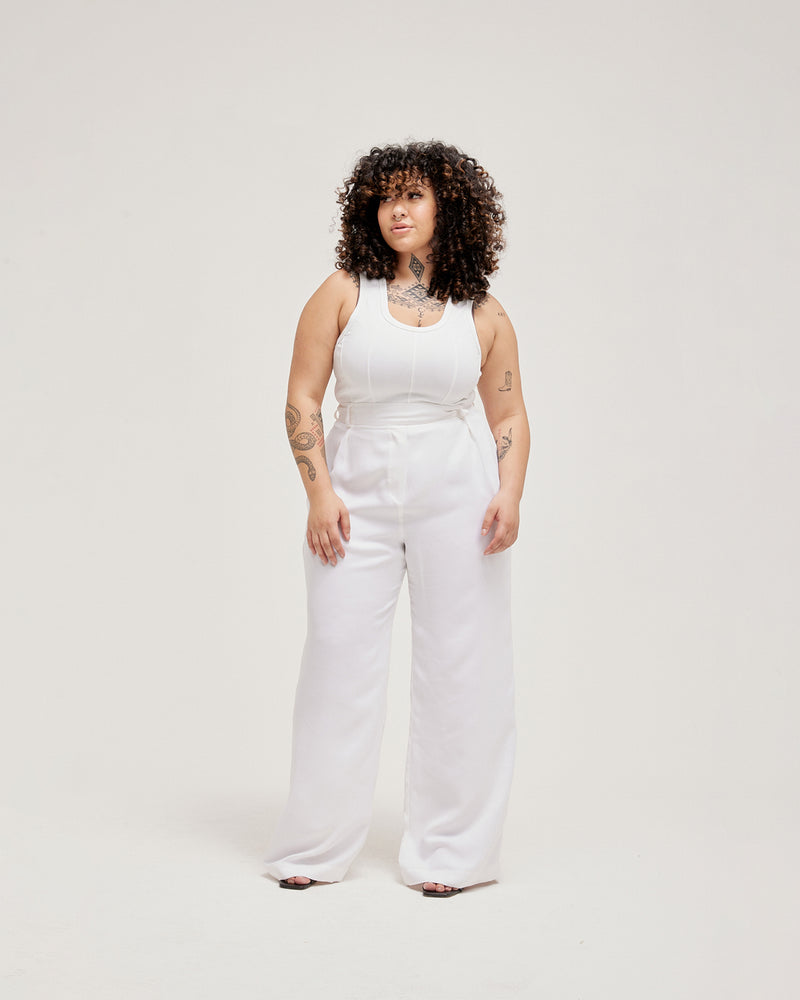 LAFAYETTE PANT WHITE | Highwaisted wide leg suit pant with front tucks to add fullness. Tailored from a soft white cupro, these pleated pants have a sweeping wide leg silhouette.