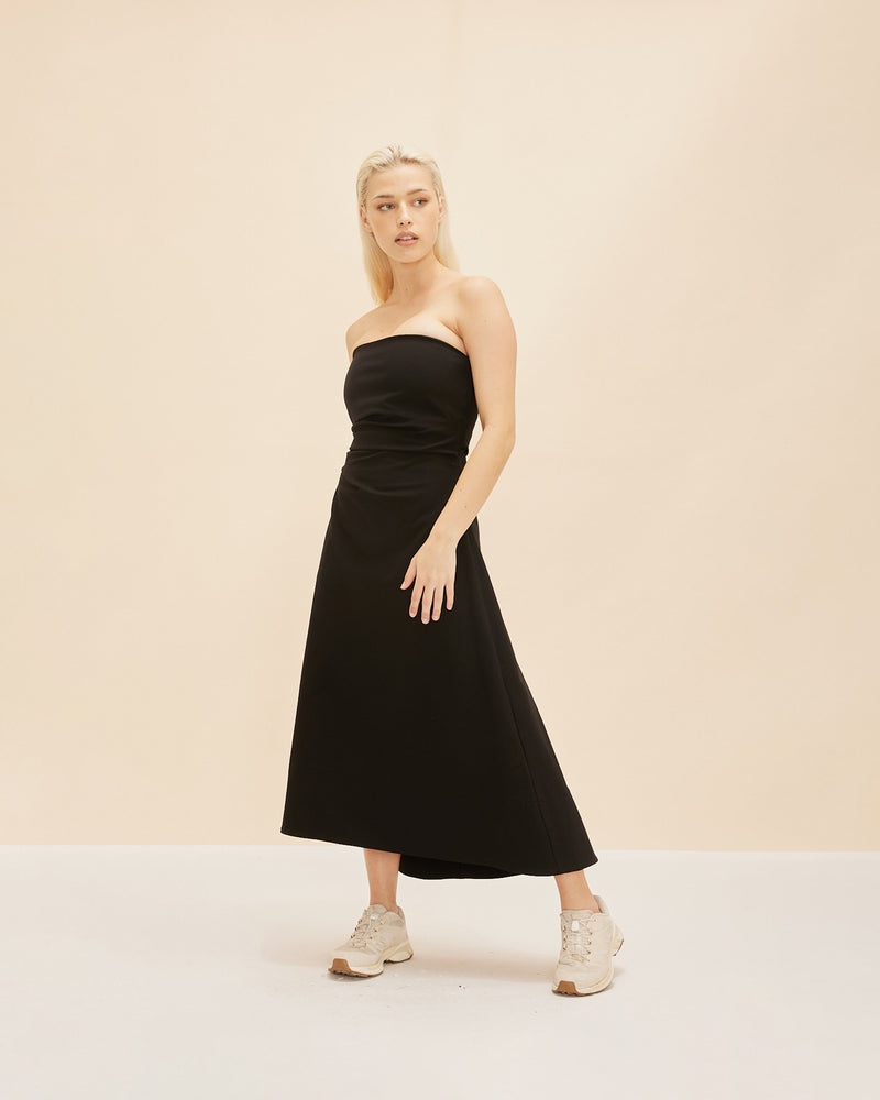 JUPITER DRESS BLACK | Strapless Dress made in a super-stretch bengaline fabric. Fitted bodice with deep waist tucks to create shape, the skirt falls in a full A-line silhouette, with a dipped back hem.