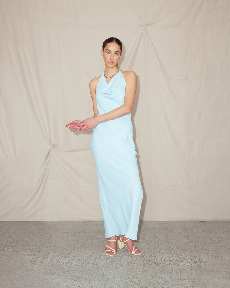 BENTEN HALTER DRESS DOLLY BLUE | The Benten Halter Dress is a bias cut full length dress with a cowl halter neck. It features a bra friendly low back and a side zip, in a playful...