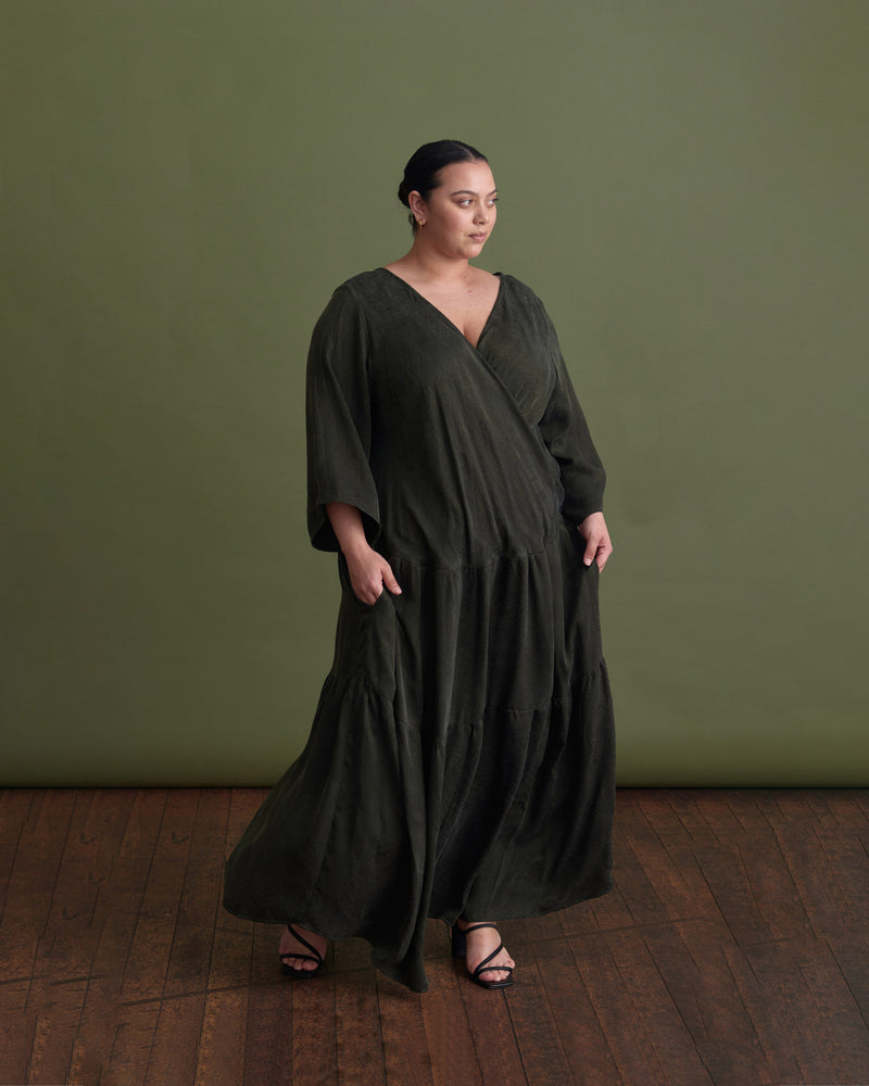 EROS MAXI DRESS KHAKI JACQUARD | Full length loose fitting dress with slightly fluted elbow length sleeves and gathered panels on the skirt to create more fullness. This dress is reversible and can be worn with...