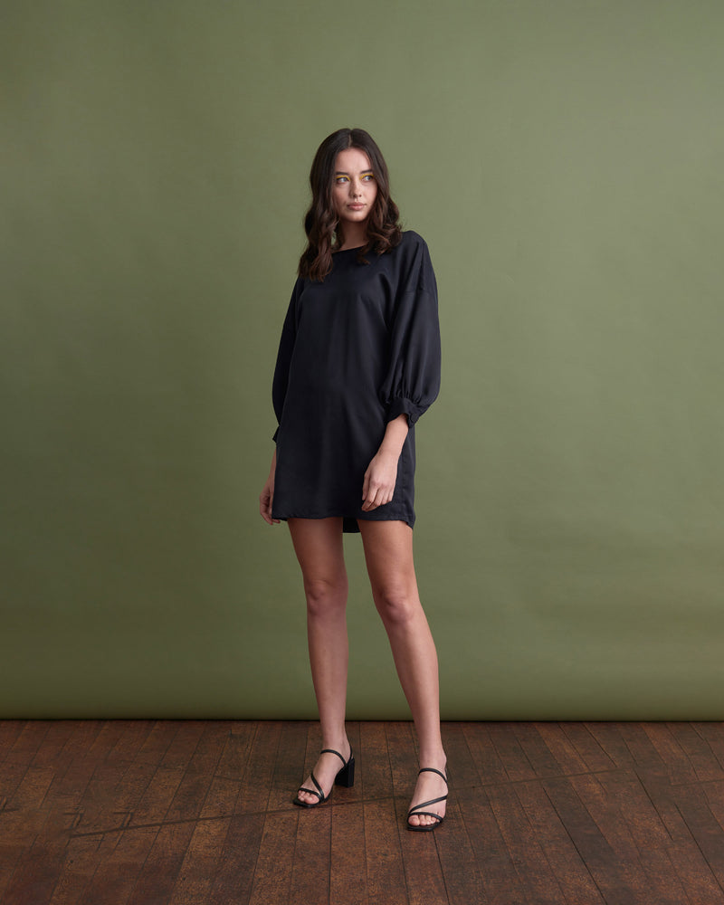 EROS MINIDRESS BLACK | The Eros Minidress is a relaxed fit drop shoulder minidress with elbow length sleeves gathered into a cuff.