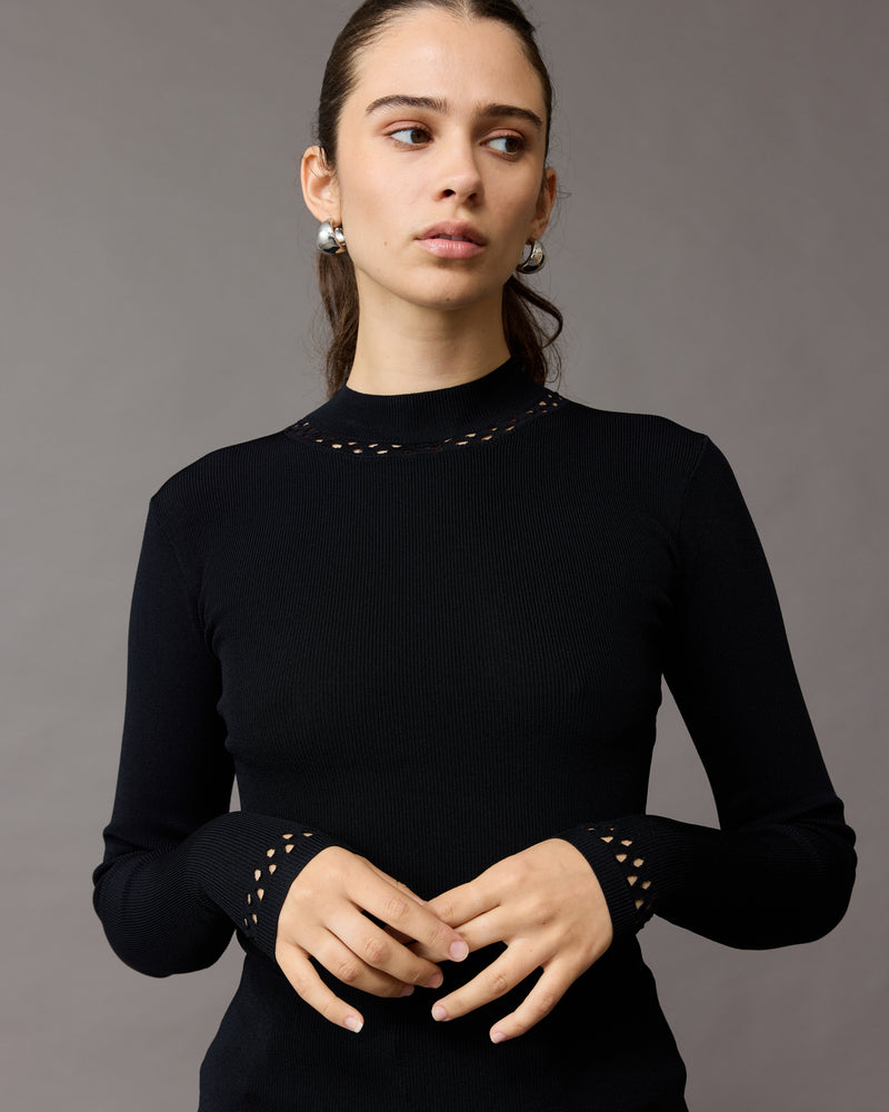 FABIENNE TURTLENECK BLACK | Long sleeve knitted top with a high neck. This top features lattice cutouts at the neck and sleeve hems, that elevate this staple piece.