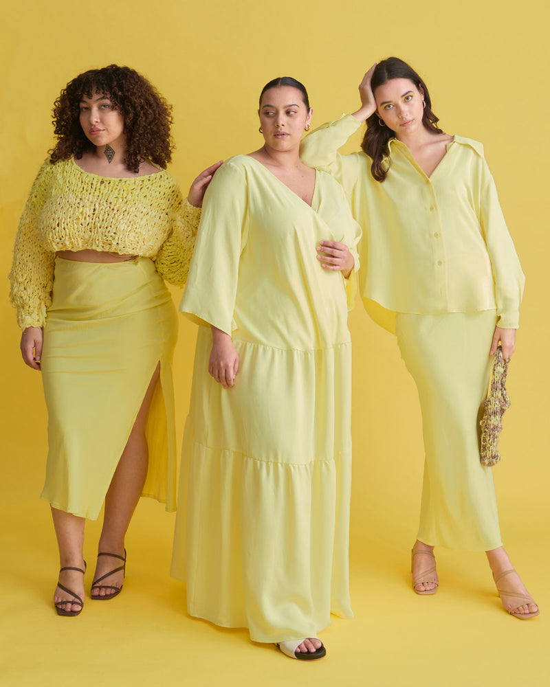 EROS MAXI DRESS LEMON | Full length loose fitting dress with slightly fluted elbow length sleeves and gathered panels on the skirt to create more fullness. This dress is reversible and can be worn with...