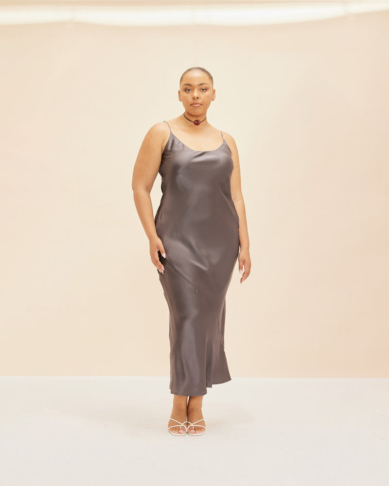 LOGAN SILK SLIP GUNMETAL | Bias cut slip cut in a gunmetal coloured silk with a lustrous sheen. Designed to highlight your natural figure, this piece is effortlessly elegant.