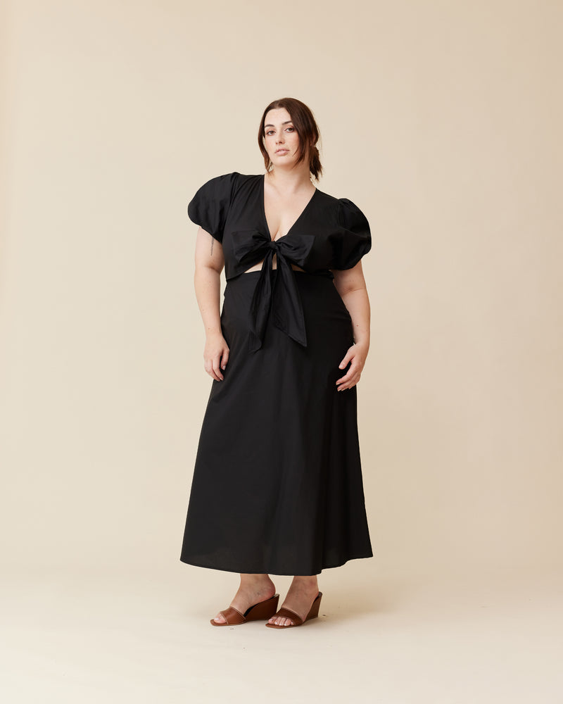 ALINA BOW DRESS BLACK | A-line midi dress designed in a crisp black cotton. Features a puff sleeve and a plunge V-neckline with a tie at the front.