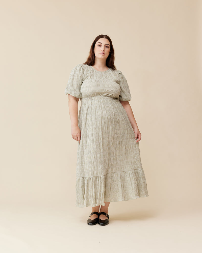 CECILE DRESS  OLIVE STRIPE | A-line maxi dress that is fitted through the top and continues into a floaty skirt, with a round neckline and short elasticated puff sleeves. The voluminous sleeves make this silhouette...
