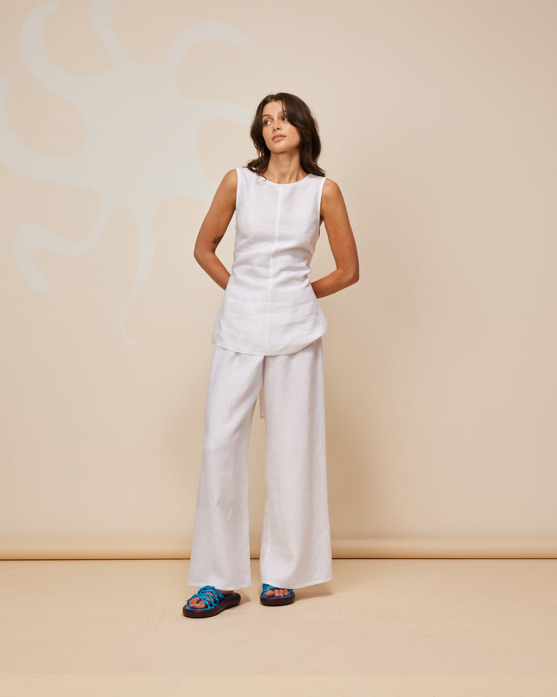 ANDIE LINEN PANT WHITE | Palazzo style elastic waist pants with a tie, in a light weight linen. These pants are high waisted, uncomplicated and classically cool.