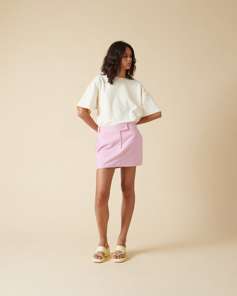 RUE MINI SKIRT MACARON | Suit style mini skirt designed in a mid-weight macaron pink fabric. Features a mid-rise waist with belt loops across the waistband and side 2 pockets to emphasise the suiting vibe.
