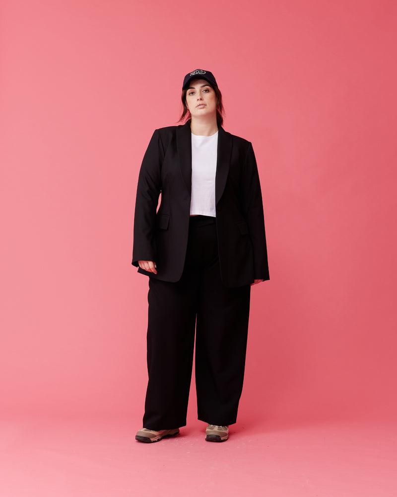 CARMY TROUSER BLACK | A high-waisted update on our favourite Rue Trouser. Features a wide leg a flat waistband and belt loops. These pants are versatile in that they can be worn casual with a...