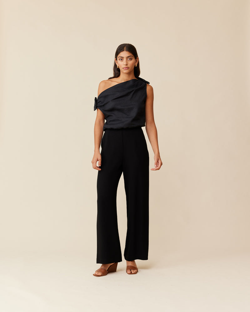 ALINA LINEN BOW TOP BLACK | One-shoulder linen top with feature bows at the shoulders. Has an elasticated hem to give the top a blouse look.