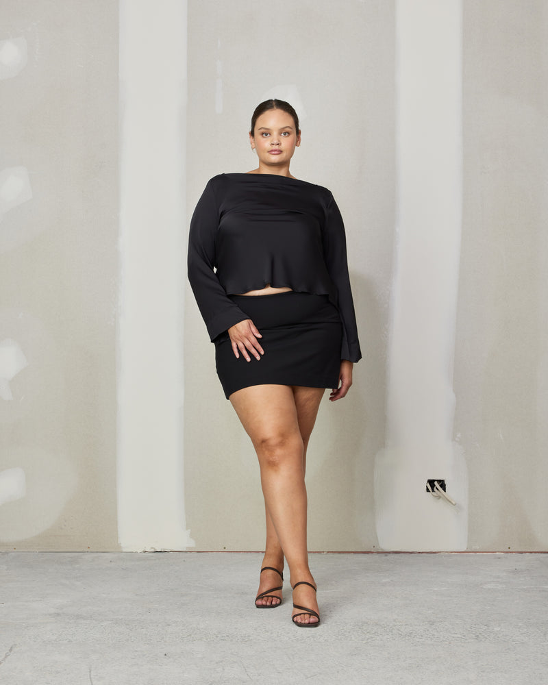 MOON MINI SKIRT BLACK | An update on our Jupiter Mini skirt with a straight hem. This skirt is designed to fit closely to the form at the waist, made in a black stretch bengaline...