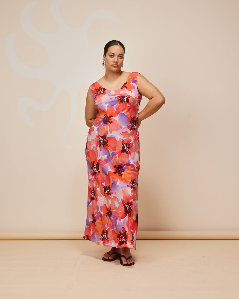 JAQUETTA SILK SLIP POPPY FLORAL | Wide strap silk midi dress designed in a striking poppy floral print. Cut on the bias with a built in waist tie, this dress skims the figure while allowing you to cinch...