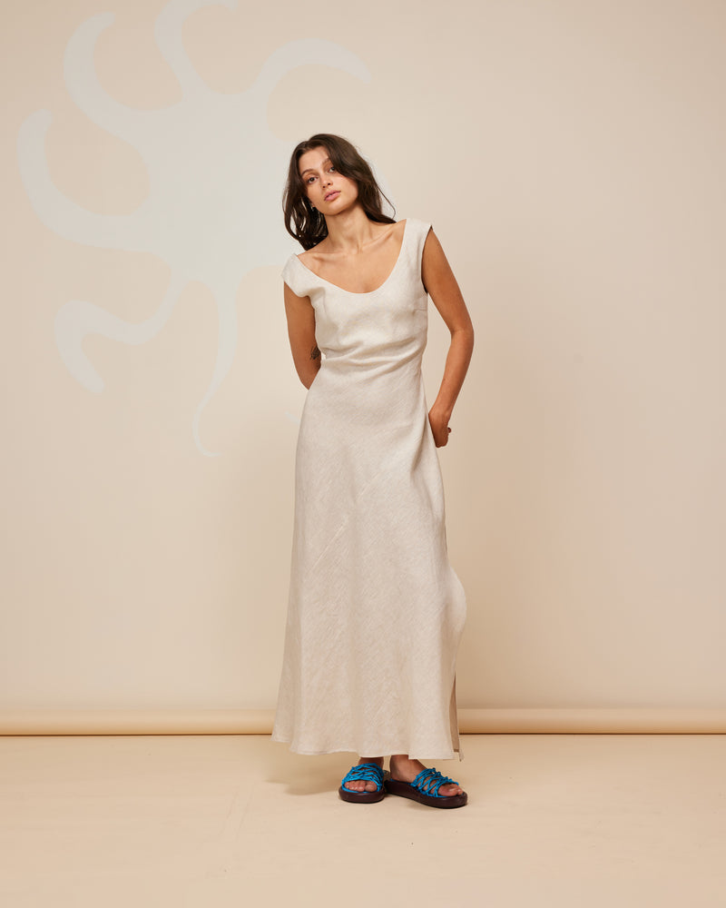 JAQUETTA LINEN SLIP NATURAL | Cap-sleeve linen midi dress with a side split, designed in a natural colour. Cut on the bias with a built in waist tie, this dress skims the figure while allowing you to...