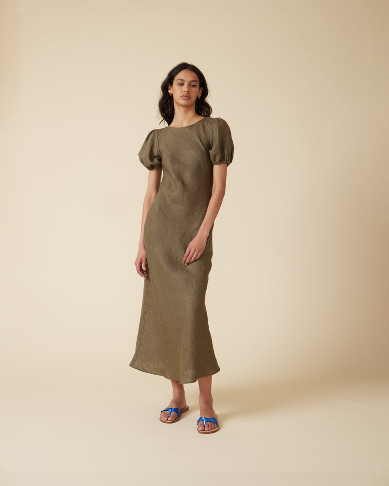 KOS LINEN DRESS KHAKI | An update on a much loved Rubette favourite, the Kos Linen Dress is a bias cut dress with a subtle puff sleeve and cut out back with neck-ties. Cut from...