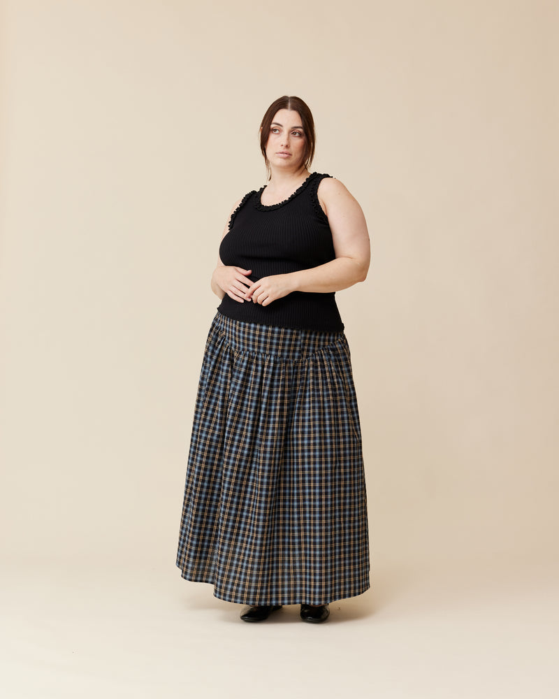 TRULLI SKIRT BLACK TARTAN | Floaty basque style maxi skirt imagined in a black tartan cotton. This skirt features a dropped bodice style waistline, that falls to a full, wide skirt.