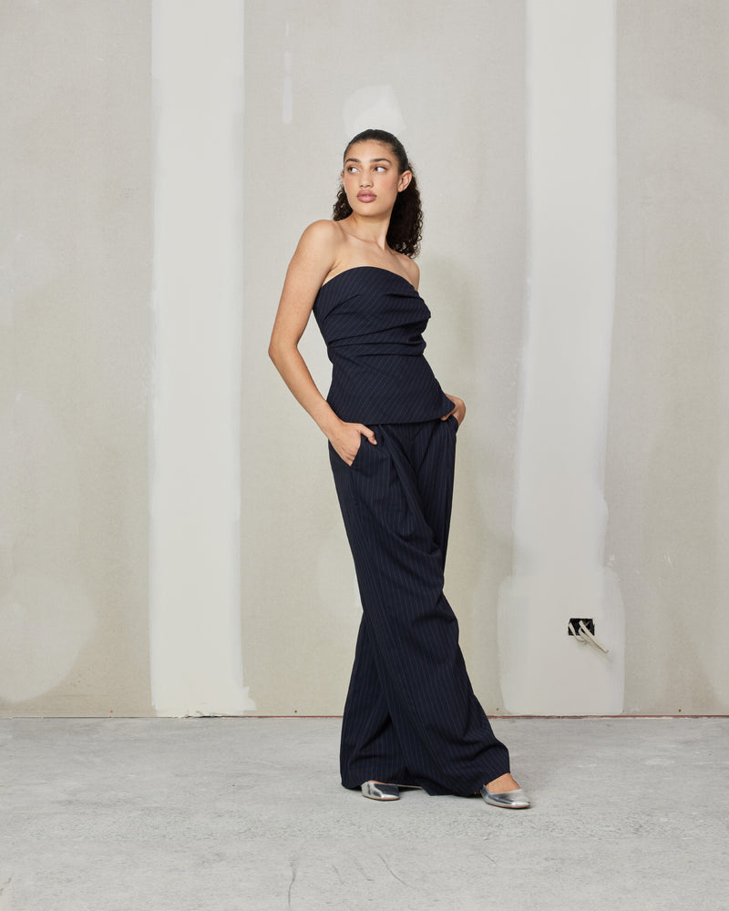 MILO BODICE NAVY PINSTRIPE | Bodice style top with pleated detail down the front, crafted in a navy pinstripe fabric that adds to the structure of the piece. In a strapless silhouette, this piece is darted...