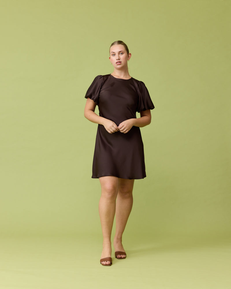 KENDALL SATIN MINI DRESS ESPRESSO | Bias cut satin mini dress with puff sleeves and a keyhole button closure at the back neck. The bias silhouette of this dress gently contours the body.
