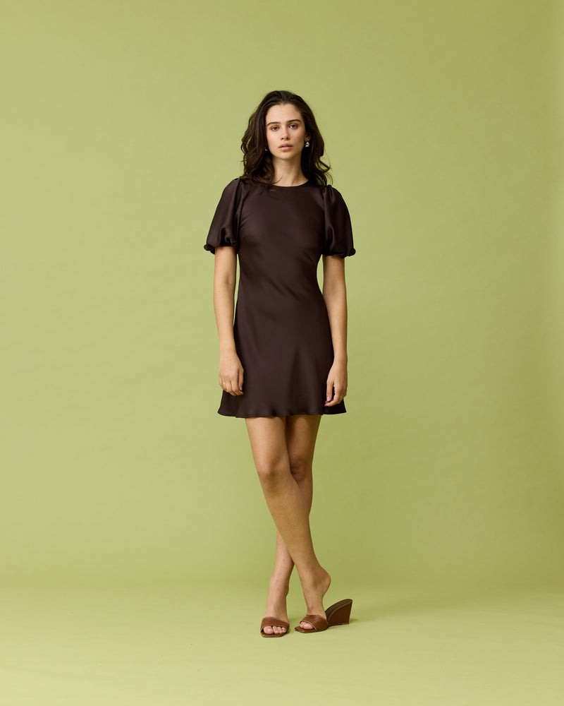 KENDALL SATIN MINI DRESS ESPRESSO | Bias cut satin mini dress with puff sleeves and a keyhole button closure at the back neck. The bias silhouette of this dress gently contours the body.