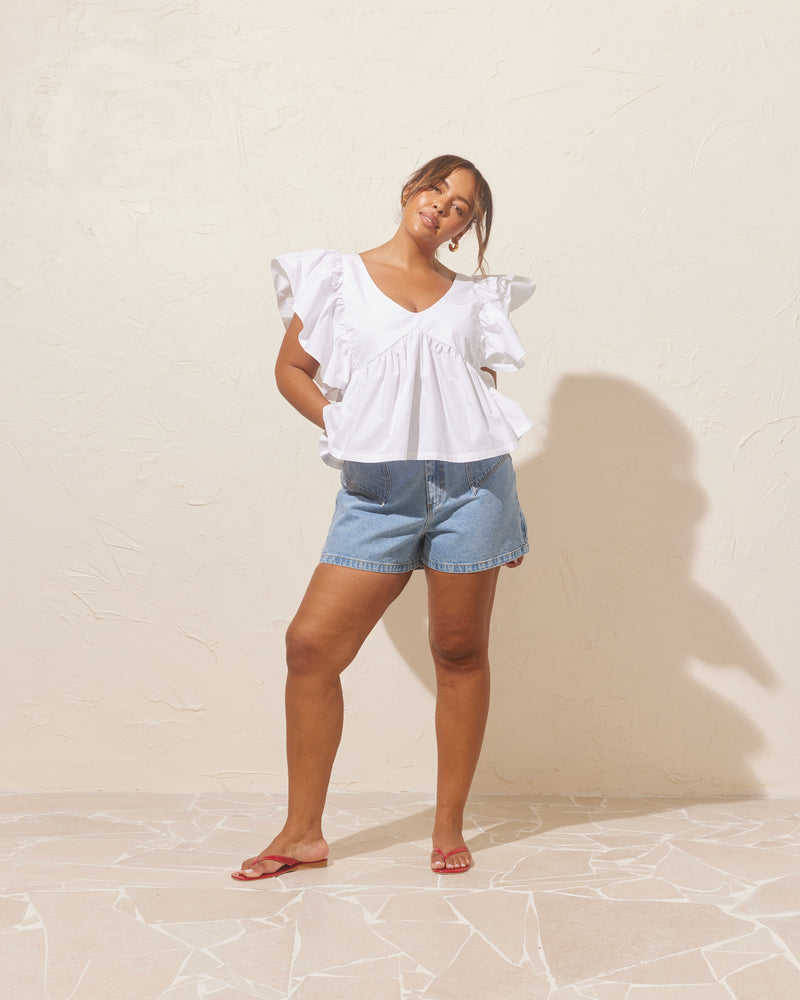 CLOVER DENIM SHORT BLUE | Our classic high waisted denim short in blue, made in a soft washed denim, ready for easy strides and warm weather. It isn't Rubette summer without the Clover Short.