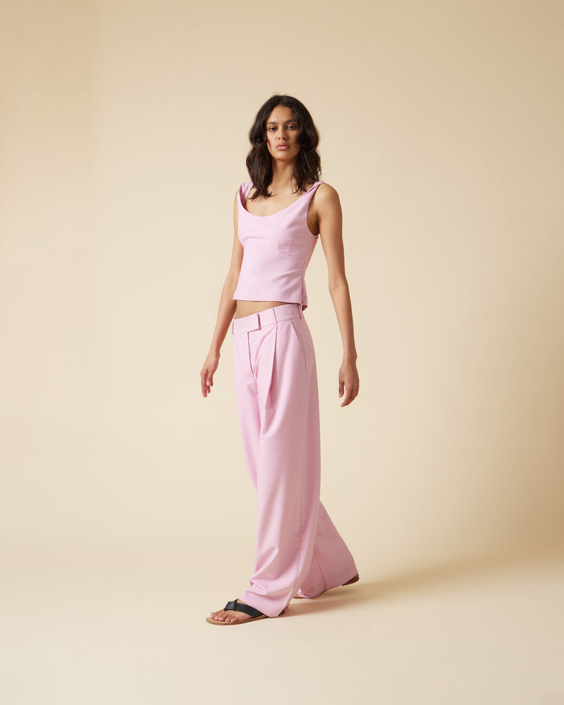 RUE TROUSER MACARON | Straight leg mid-waist suit trouser with a flat waistband and belt loops. These pants are versatile in that they can we be worn casual with a baby tee, or dressed...