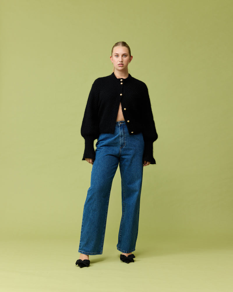 MATILDA CARDIGAN BLACK | Button-down cardigan with gold metallic dome buttons and a slightly puff-shouldered silhouette. Features an exaggerated flute cuff crafted in a chunky mohair and wool blend.