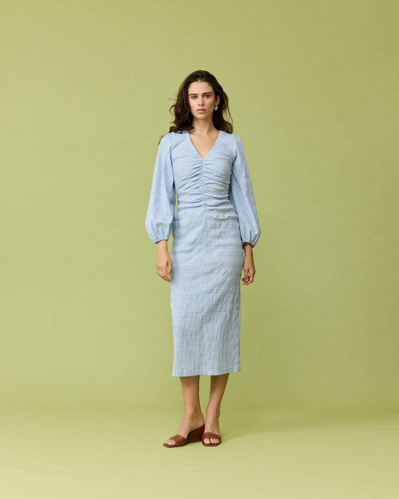 CANARY MIDI DRESS BLUE GINGHAM | Long sleeve midi dress with a V-neck designed in a blue check. This dress features a gathered seam down the centre front, that creates ruching around the body.