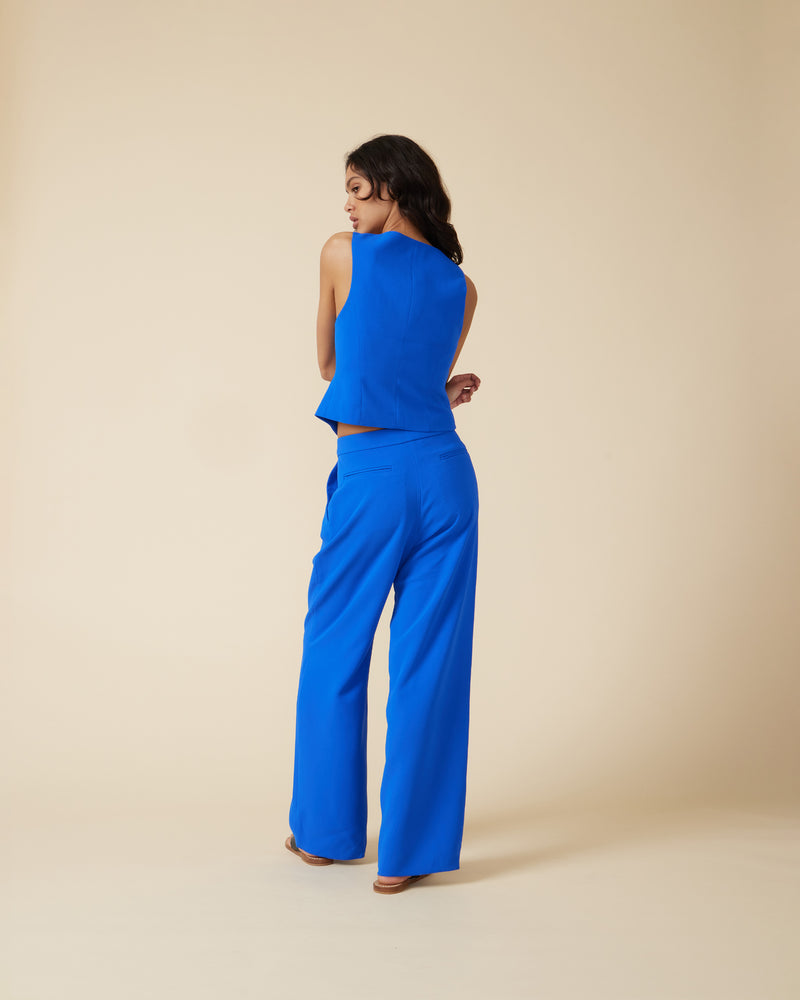 SID TROUSER COBALT | Mid-rise wide-leg suit pant designed in a striking cobalt colour. Featuring front pleats and pockets, these pants pair perfectly with the Sid vest.