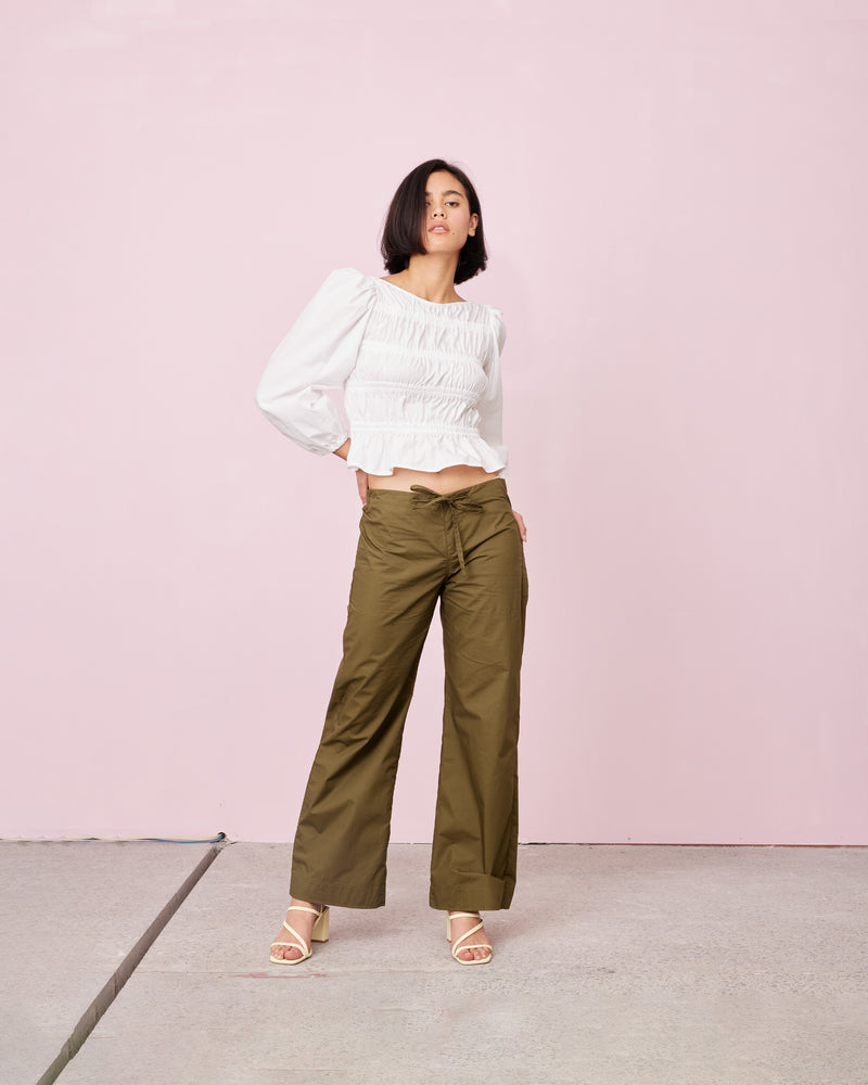 COMET BLOUSE WHITE | Long sleeve cotton blouse with shirring throughout the body to create texture. Features elastic at the cuff to create a sublte puff sleeve.